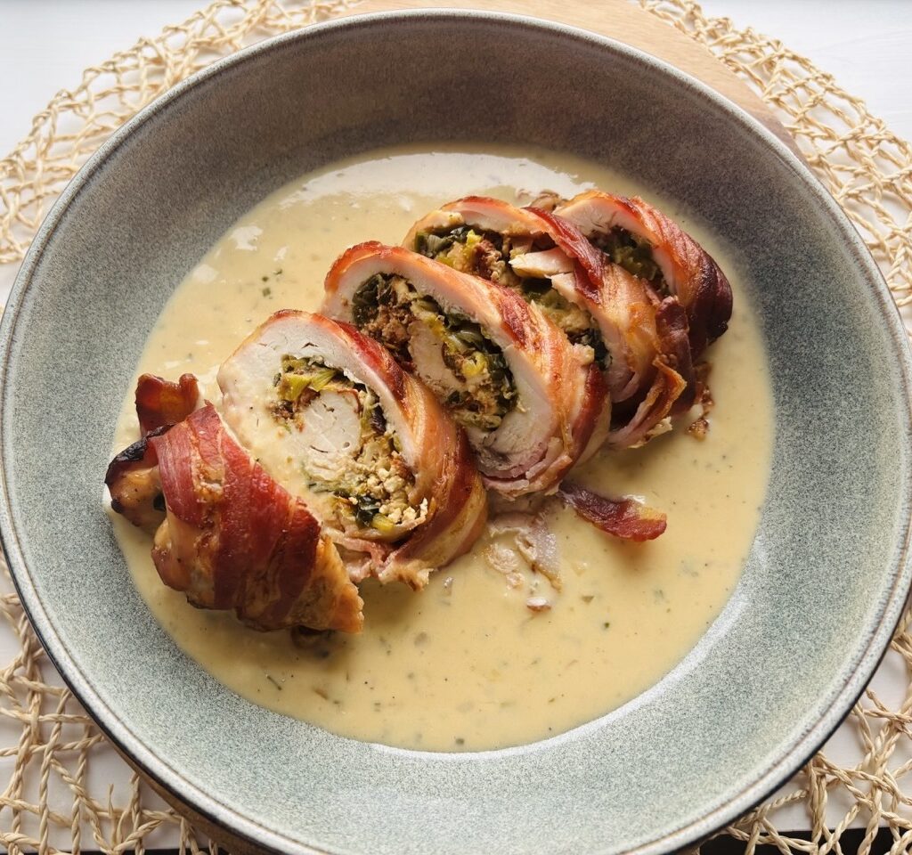 Bacon-Wrapped Stuffed Chicken with Creamy White Wine Sauce