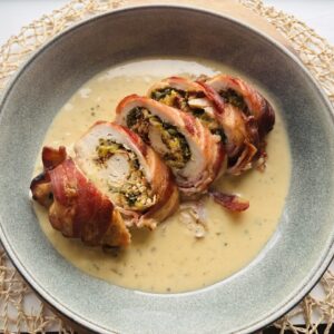 Bacon-Wrapped Stuffed Chicken with Creamy White Wine Sauce